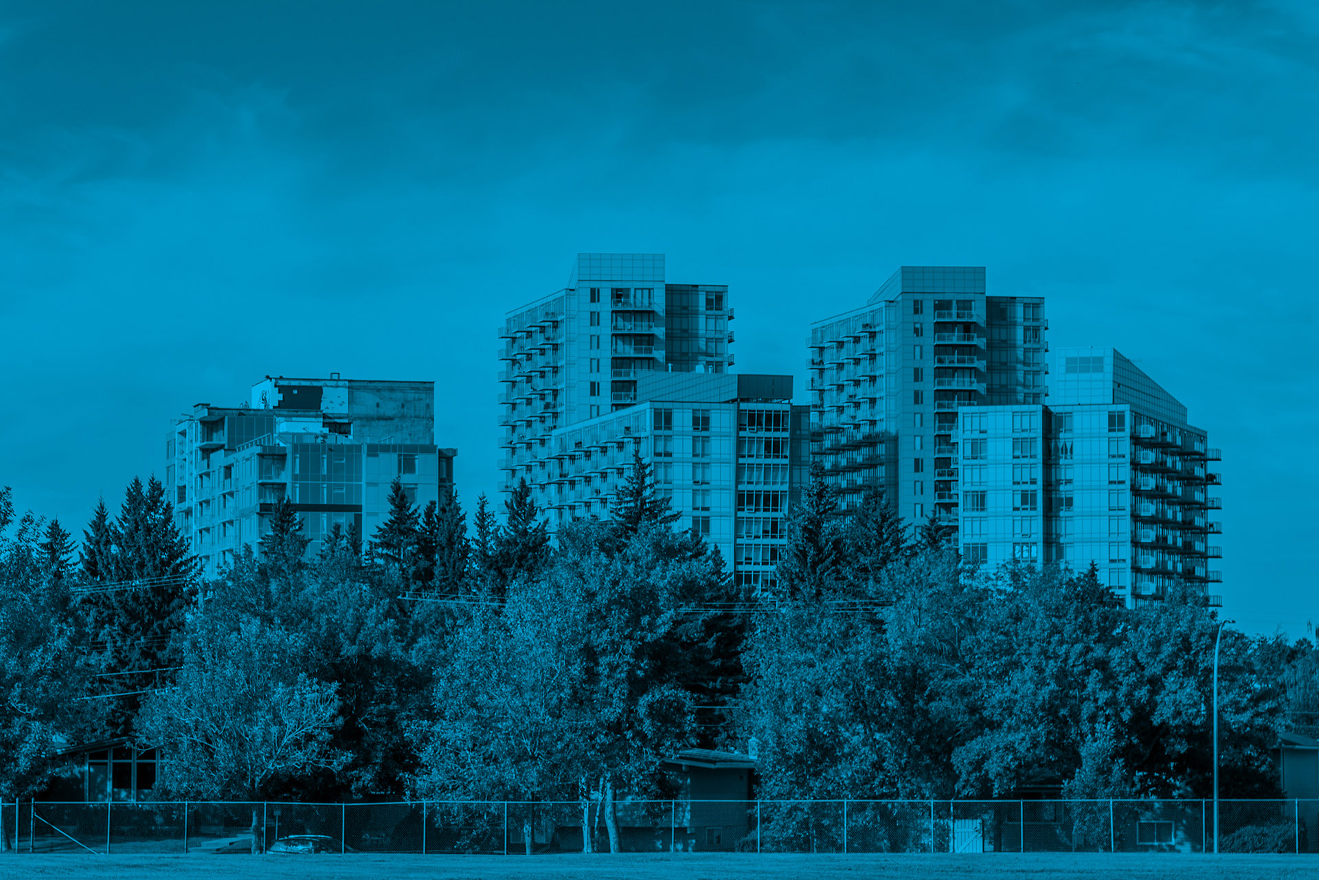 Condominium buildings representing key aspects of condo insurance in Alberta, including coverage responsibilities and compliance requirements.