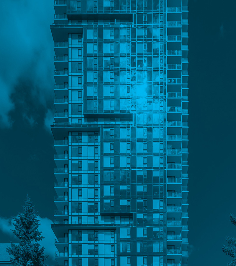 A tall modern condo building; an example of a property where owners must research what are HOA fees for shared maintenance.