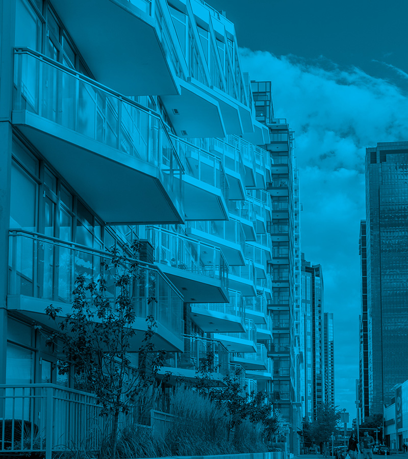 Modern high-rise condo building; a visual for understanding condo owner responsibilities like interior maintenance and common area rules.