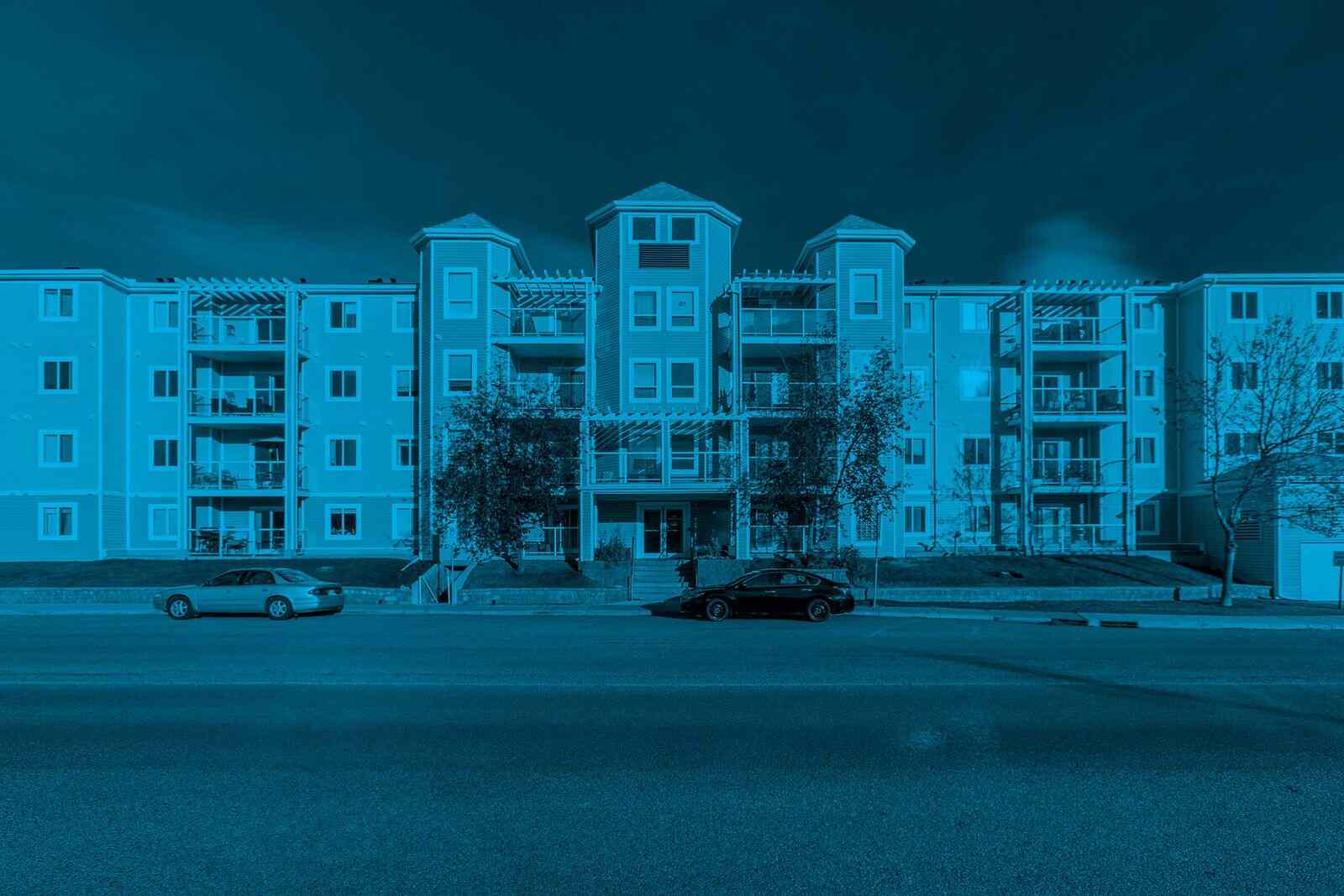 Condominium building with designated parking areas illustrating the importance of condo parking control for organized and well-managed residential communities.
